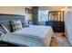 Cozy bedroom features a comfortable queen bed, stylish dresser, neutral decor, and natural light at 730 S Royal Crest Cir # 426, Las Vegas, NV 89169