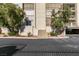 Street view of condo entrance with stairs, landscaping, and covered parking at 730 S Royal Crest Cir # 426, Las Vegas, NV 89169