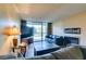 Inviting living room featuring tile floors, neutral paint and sliding glass doors at 730 S Royal Crest Cir # 426, Las Vegas, NV 89169