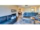 Welcoming living room with a fireplace, tile flooring, and comfortable seating at 730 S Royal Crest Cir # 426, Las Vegas, NV 89169