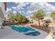 Backyard featuring a pool, spa, trees, and mature landscaping at 7317 Bosky Springs St, Las Vegas, NV 89131