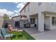 Backyard featuring a covered patio, outdoor seating, and a barbecue area for entertaining at 7317 Bosky Springs St, Las Vegas, NV 89131