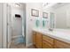 Bathroom featuring tile floors, a wood vanity, and a shower with a blue curtain at 7317 Bosky Springs St, Las Vegas, NV 89131