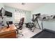 Bedroom featuring carpet floors, a desk, workout equipment, and a window at 7317 Bosky Springs St, Las Vegas, NV 89131