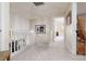 Upstairs hallway with neutral carpet and walls that leads to a bedroom at 7317 Bosky Springs St, Las Vegas, NV 89131