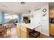 Kitchen with a central island, wood floors, and sliding glass doors at 7317 Bosky Springs St, Las Vegas, NV 89131