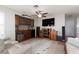 Living room featuring wood built ins with a wine refrigerator and ceiling fan at 7317 Bosky Springs St, Las Vegas, NV 89131