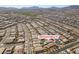 Aerial view of home with pool, neighborhood, and surrounding desert landscape at 792 Drammatico Pl, Henderson, NV 89011