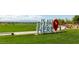 Community park sign on green grass with walking trails, water feature, and mountain backdrop at 792 Drammatico Pl, Henderson, NV 89011