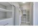 Well-organized walk-in closet with ample shelving, drawers, and hanging space for efficient storage at 792 Drammatico Pl, Henderson, NV 89011