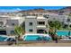 Stunning aerial view of home showcasing the modern design, pools, and lush landscaping at 795 Glistening Light Ct, Henderson, NV 89052