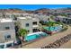 Aerial view of home with a pool, spa, covered patio, and landscaped backyard at 795 Glistening Light Ct, Henderson, NV 89052