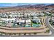 Aerial shot of homes with pools in a desert community, offering modern living and scenic views at 795 Glistening Light Ct, Henderson, NV 89052