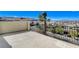 Spacious balcony with wrought iron railings offers views of the neighborhood and distant mountains at 795 Glistening Light Ct, Henderson, NV 89052