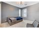 Charming bedroom features bright light, a stylish daybed, and comfortable seating for a cozy retreat at 795 Glistening Light Ct, Henderson, NV 89052
