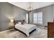 Serene bedroom features bright windows, stylish lighting, and a plush bed for ultimate relaxation at 795 Glistening Light Ct, Henderson, NV 89052