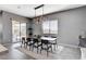 Elegant dining area featuring contemporary lighting and a sliding door with outdoor access at 795 Glistening Light Ct, Henderson, NV 89052