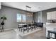 Modern dining room featuring stylish lighting, mountain views, and space for a large table at 795 Glistening Light Ct, Henderson, NV 89052