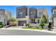 Modern home with a sleek design, two-car garage, and landscaped front yard at 795 Glistening Light Ct, Henderson, NV 89052