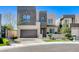 Stunning modern two-story home featuring a two-car garage and manicured front yard at 795 Glistening Light Ct, Henderson, NV 89052