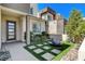 Contemporary home features a modern water feature, easy care yard and stylish entrance at 795 Glistening Light Ct, Henderson, NV 89052