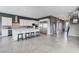 Open-concept kitchen featuring an island with seating and stainless steel appliances at 795 Glistening Light Ct, Henderson, NV 89052