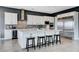 Stylish kitchen boasts white cabinetry, stainless steel appliances, and a marble island at 795 Glistening Light Ct, Henderson, NV 89052