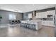 Spacious kitchen with large island, sleek cabinetry, and a dining area with mountain views at 795 Glistening Light Ct, Henderson, NV 89052