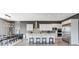 Bright kitchen featuring stainless steel appliances, a large island, and adjacent dining area at 795 Glistening Light Ct, Henderson, NV 89052