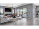 Bright living room features an open floorplan with access to the outdoor kitchen at 795 Glistening Light Ct, Henderson, NV 89052