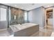Luxurious primary bathroom showcasing a glass-enclosed shower and large soaking tub at 795 Glistening Light Ct, Henderson, NV 89052
