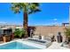 Outdoor patio with comfortable seating around a modern fire pit and city views at 795 Glistening Light Ct, Henderson, NV 89052