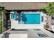 Stunning pool and spa combo is surrounded by patio furniture and landscaping at 795 Glistening Light Ct, Henderson, NV 89052