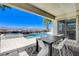 Outdoor covered patio with dining, pool, spa and mountain views at 795 Glistening Light Ct, Henderson, NV 89052