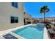 Backyard view of the pool, hot tub, and house, offering a resort-style living experience at 795 Glistening Light Ct, Henderson, NV 89052