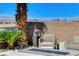 Poolside patio with comfortable seating offers stunning city views and a cozy fire feature at 795 Glistening Light Ct, Henderson, NV 89052