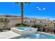 Inviting pool and spa offer a relaxing retreat surrounded by lush greenery at 795 Glistening Light Ct, Henderson, NV 89052