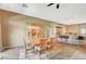 Open-concept living and dining space featuring tile floors and a built in china cabinet at 8129 Jim Steele Falls St, North Las Vegas, NV 89085