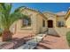 Inviting front entrance with stone steps, decorative lighting, and desert landscaping under a sunny sky at 8129 Jim Steele Falls St, North Las Vegas, NV 89085