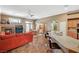 Open-concept living room with tile flooring, a cozy fireplace, and seamless flow to the kitchen at 8129 Jim Steele Falls St, North Las Vegas, NV 89085