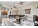 Community lounge featuring comfortable leather seating, ceiling fans and kitchenette area at 8129 Jim Steele Falls St, North Las Vegas, NV 89085