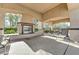 Outdoor BBQ area with stainless steel grill and stone fireplace with plenty of seating space at 8129 Jim Steele Falls St, North Las Vegas, NV 89085