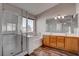 Bathroom with a double sink vanity, separate shower, soaking tub, and wood look floors at 1036 Kennebunk Cir, Henderson, NV 89015