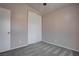 Bedroom featuring gray carpet, neutral walls, and a closet with sliding doors at 1036 Kennebunk Cir, Henderson, NV 89015