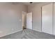 Neutral bedroom featuring gray carpet and a closet with sliding doors at 1036 Kennebunk Cir, Henderson, NV 89015