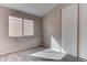 Bedroom featuring gray carpet, window with blinds, and closet with sliding doors at 1036 Kennebunk Cir, Henderson, NV 89015