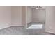 Neutral bedroom featuring gray carpet and a ceiling fan at 1036 Kennebunk Cir, Henderson, NV 89015