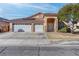 Charming single-story home with a three-car garage and desert landscaping at 1036 Kennebunk Cir, Henderson, NV 89015
