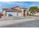 Attractive single-story home featuring a three-car garage and low-maintenance front yard at 1036 Kennebunk Cir, Henderson, NV 89015