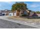 Inviting single-story home with a three-car garage and well-maintained landscaping at 1036 Kennebunk Cir, Henderson, NV 89015